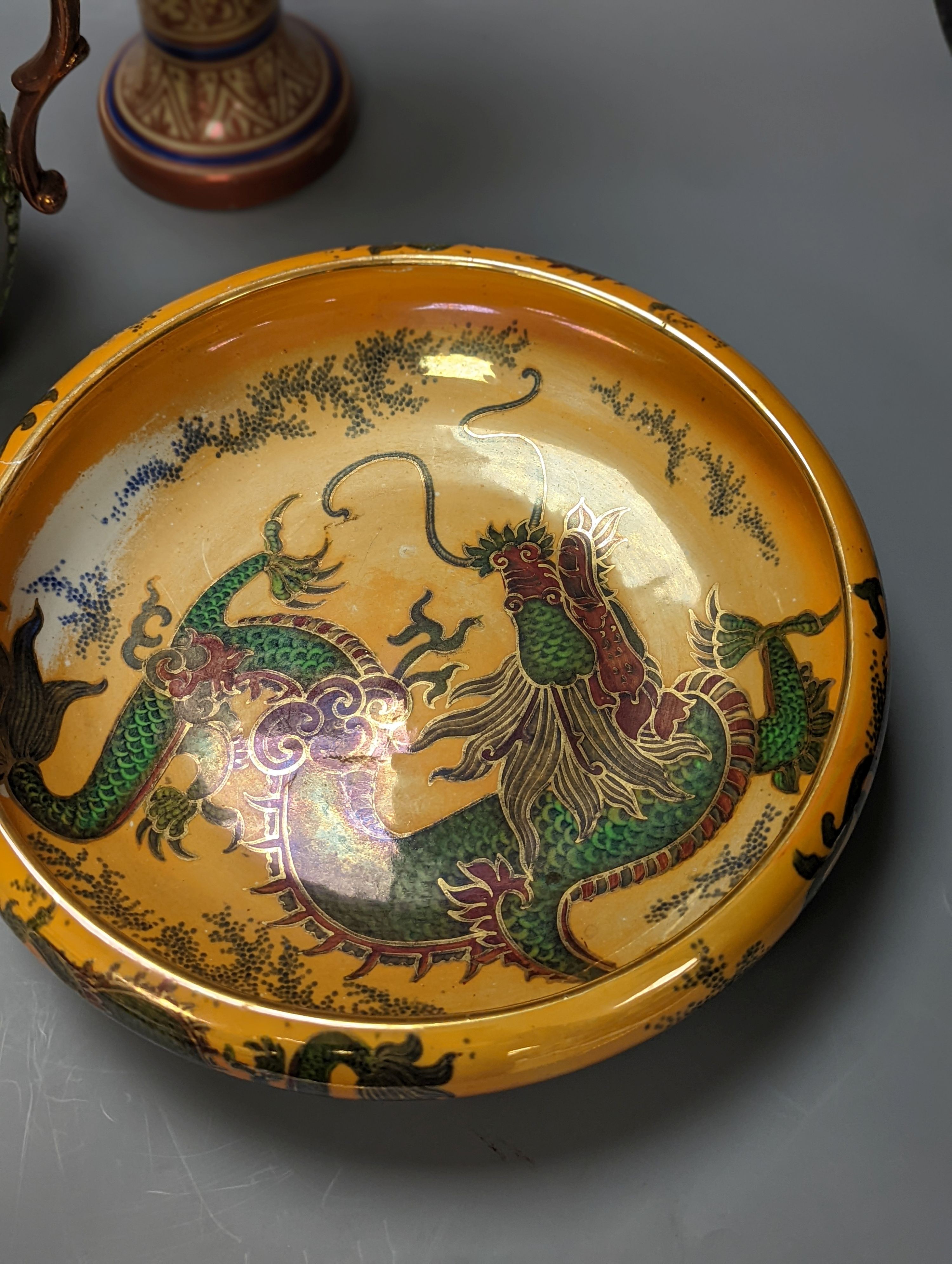 A Burley ware lustre dragon bowl, a lustre and fox glove designed jug and a Hispano-Moresque style copper lustre vase, Vase 38 cms high.